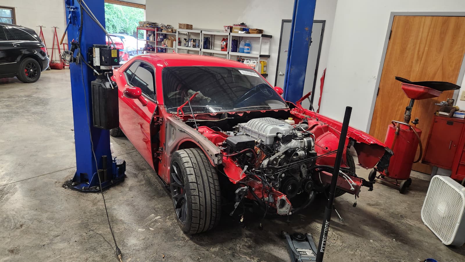 Collision repair — vehicle with open engine bay