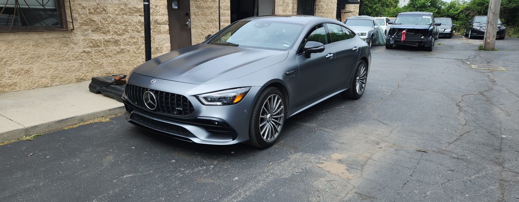 Mercedes-AMG GT 53 front view outside the shop