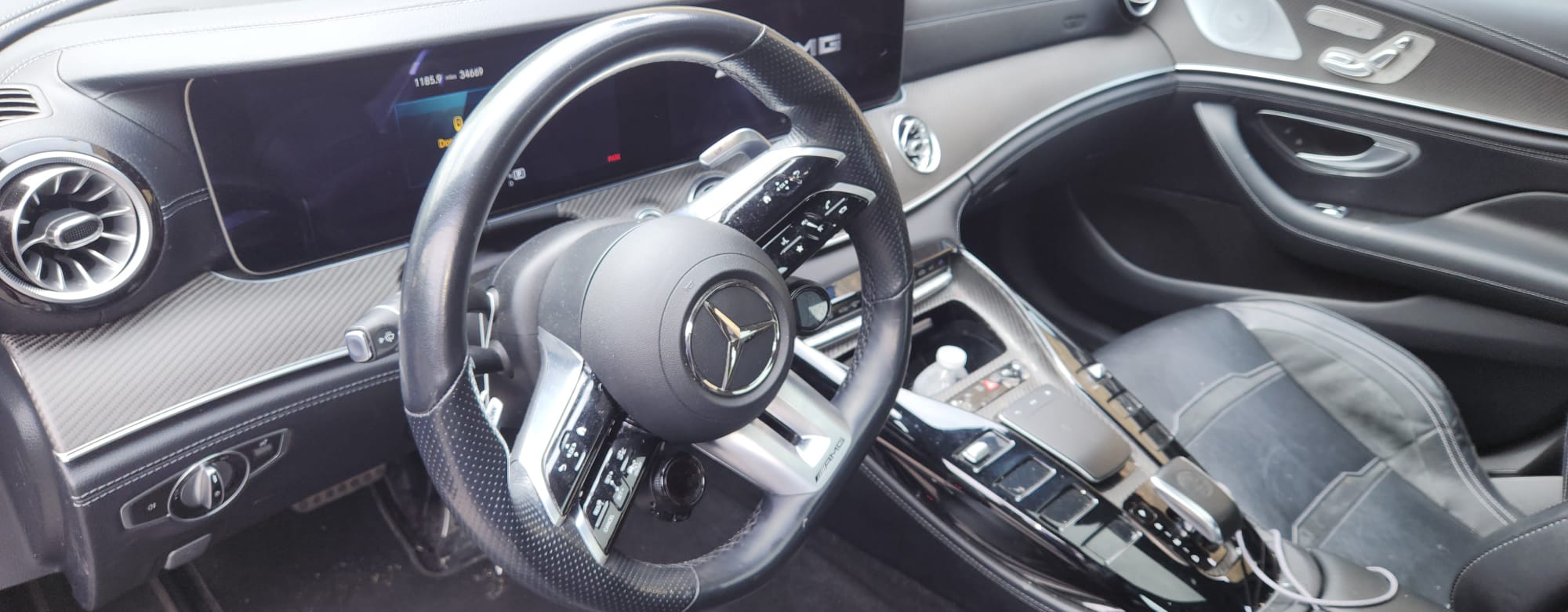 Mercedes-AMG GT interior — carbon fiber dash and AMG steering wheel
