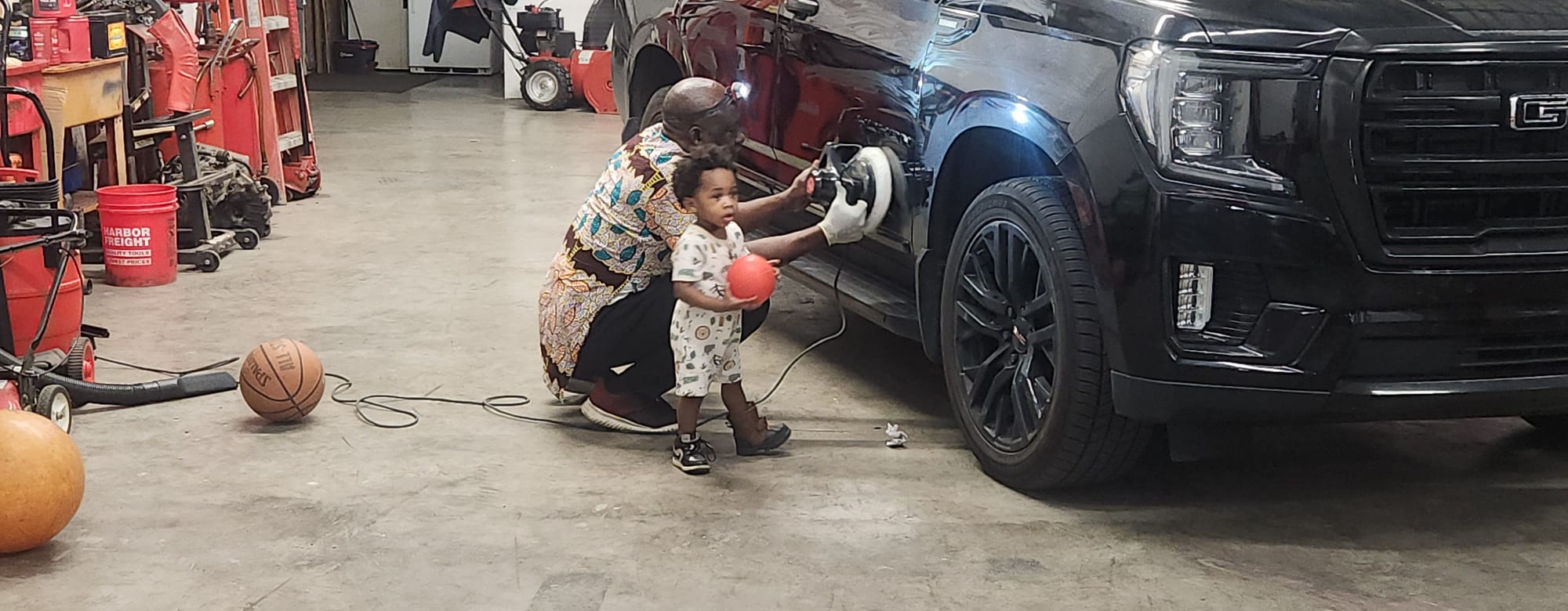 Close-up polishing on GMC Yukon with buffer