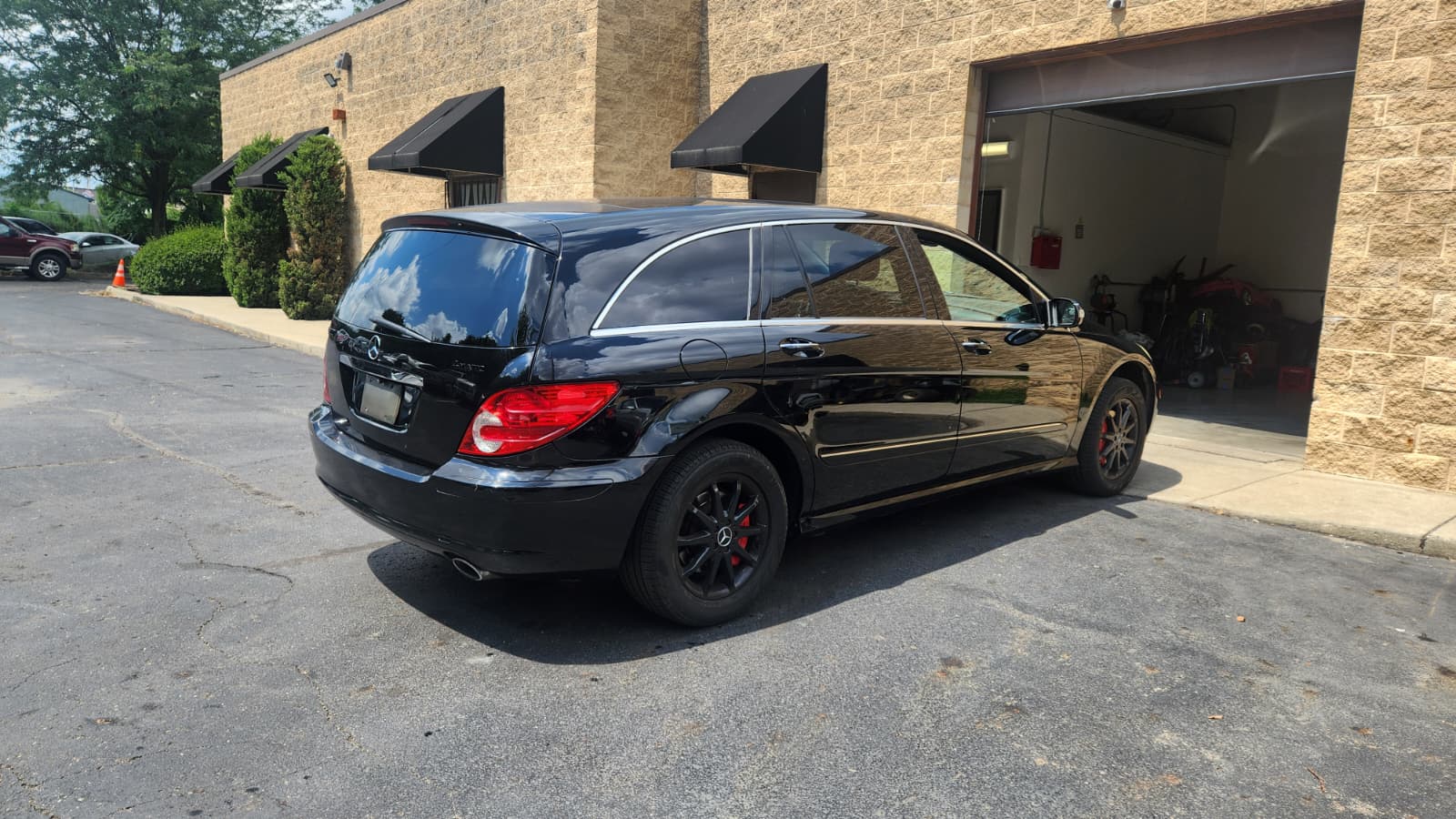 Black Mercedes entering the Auto Import Group service bay