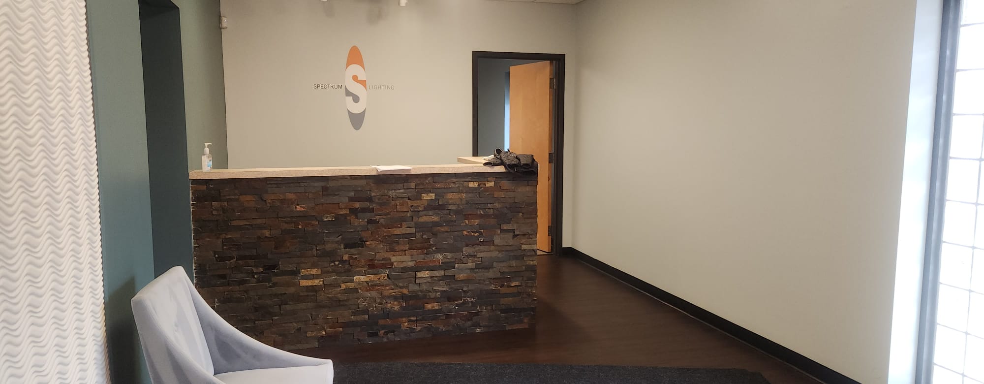 Front reception desk with stone accent wall