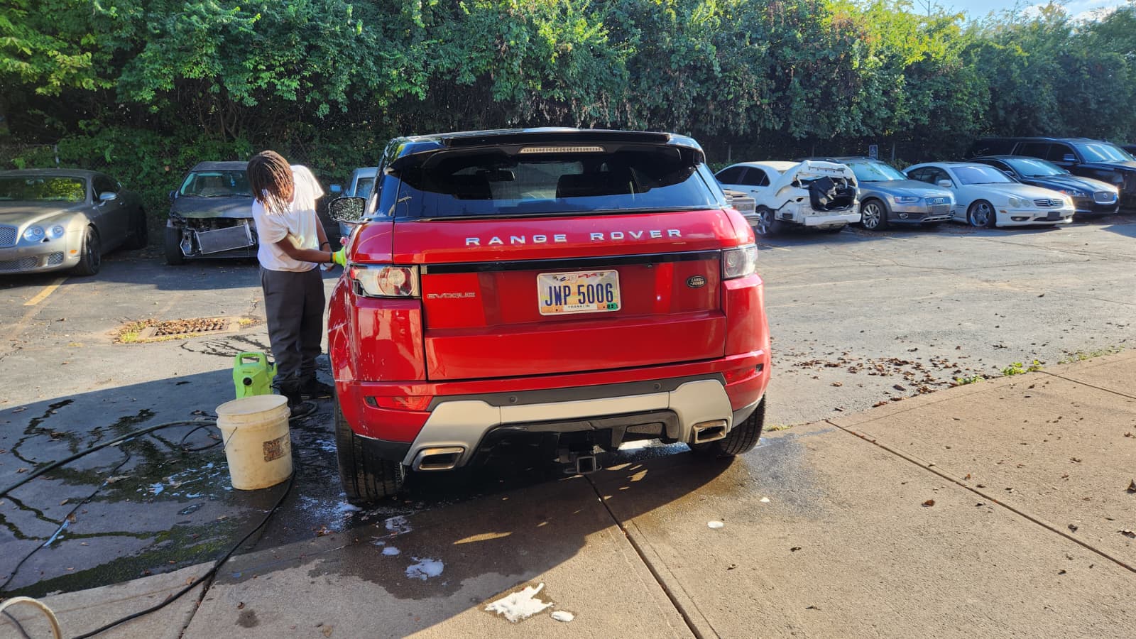 Red Range Rover Evoque being washed
